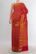 Pure Silk Red Kanchipuram Saree with Zari Butta on the body and Silk Border.  displayed on a mannequin