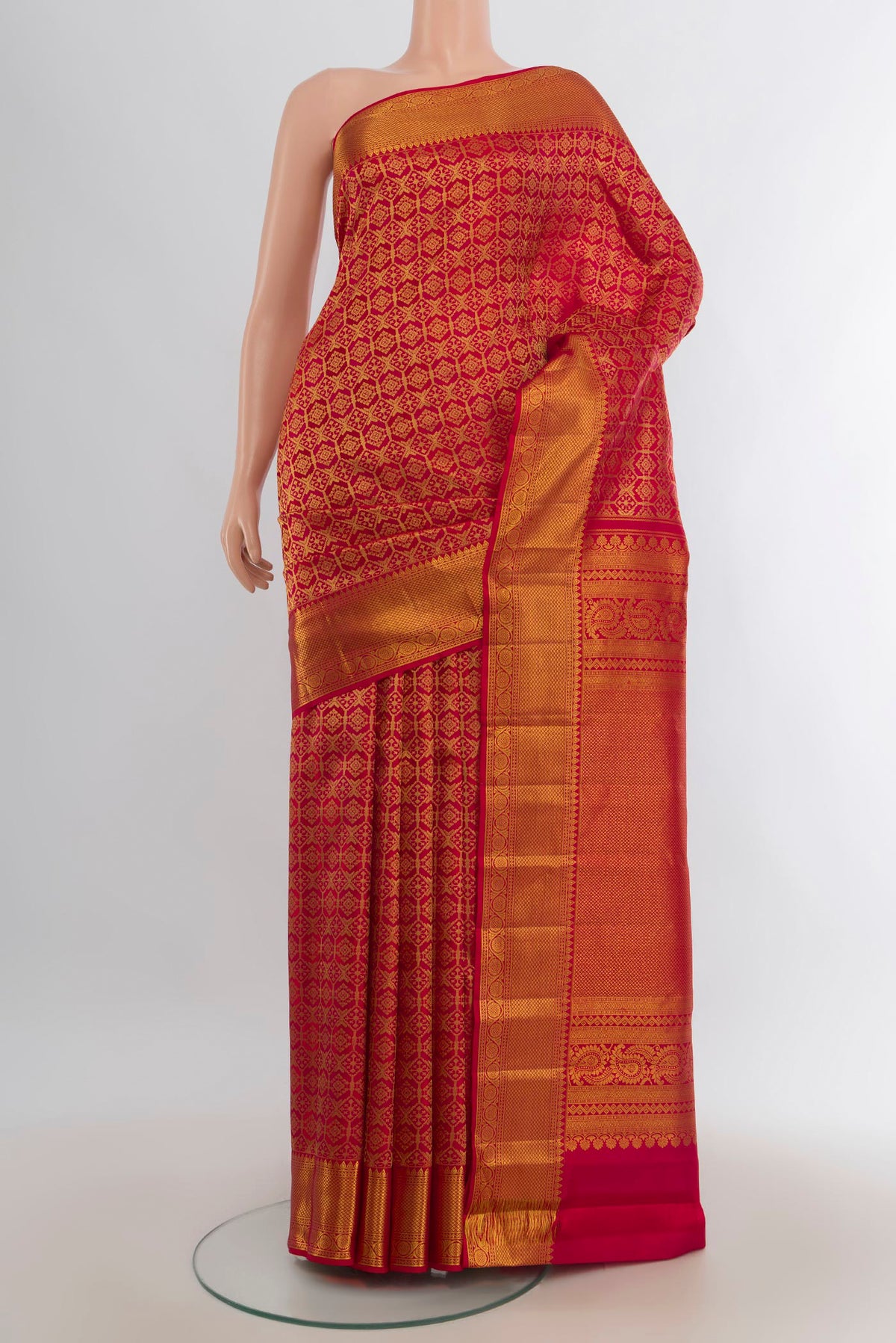 Pure Silk Red Kanchipuram Saree with Zari Butta on the body and Silk Border.  displayed on a mannequin