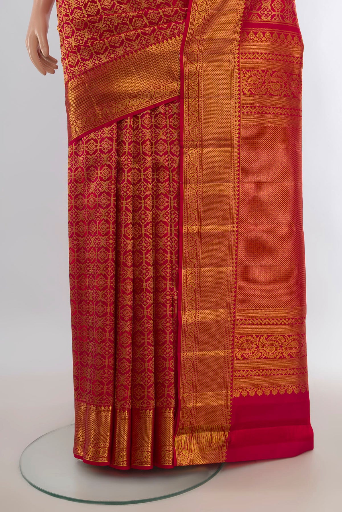 Pleats and pallu of Pure Silk Red Kanchipuram Saree with Zari Butta on the body and Silk Border. 