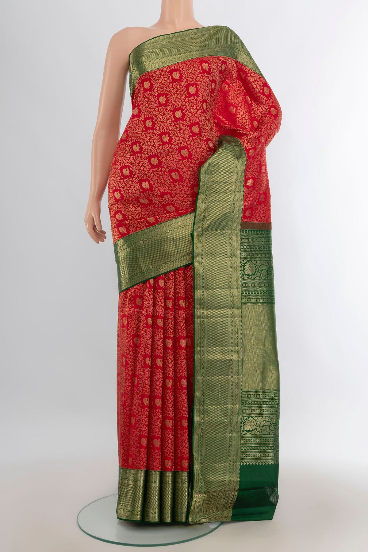 Pure Silk Red Kanjivaram Saree with Zari Butta on the body and Silk Border.  displayed on a mannequin