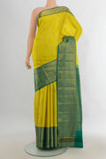 Pure Silk Light Green Kanjivaram Saree with Zari Butta on the body and Silk Border.  displayed on a mannequin