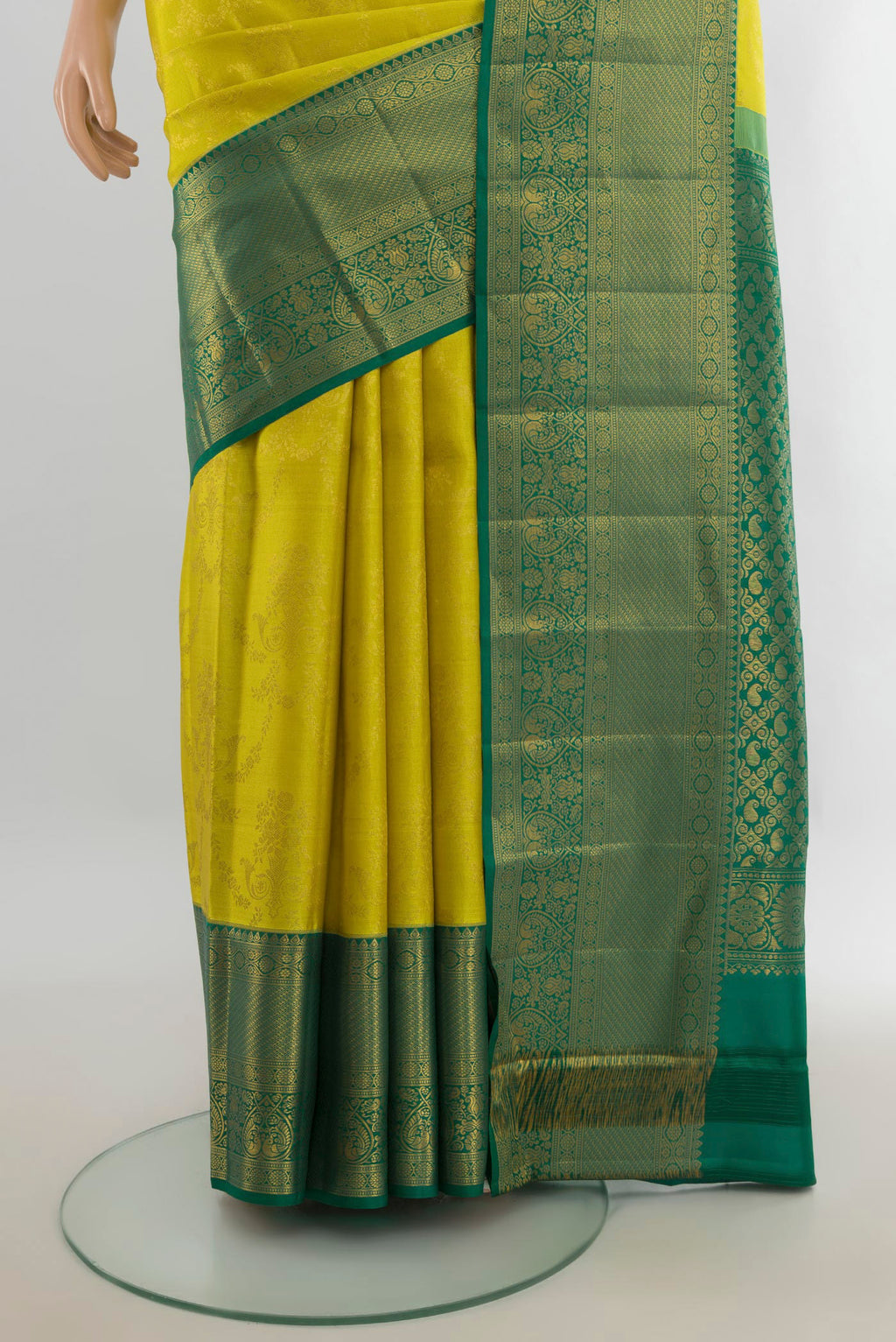 Pleats and pallu of Pure Silk Light Green Kanjivaram Saree with Zari Butta on the body and Silk Border. 