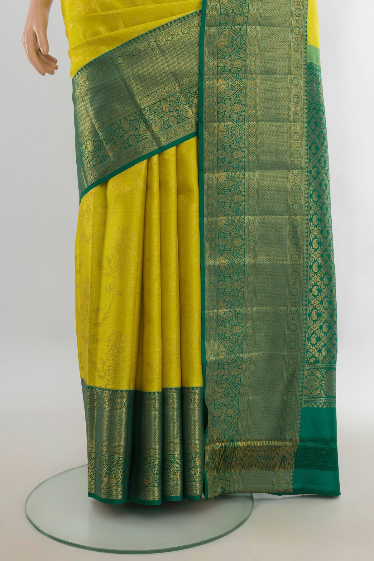 Pleats and pallu of Pure Silk Light Green Kanjivaram Saree with Zari Butta on the body and Silk Border. 