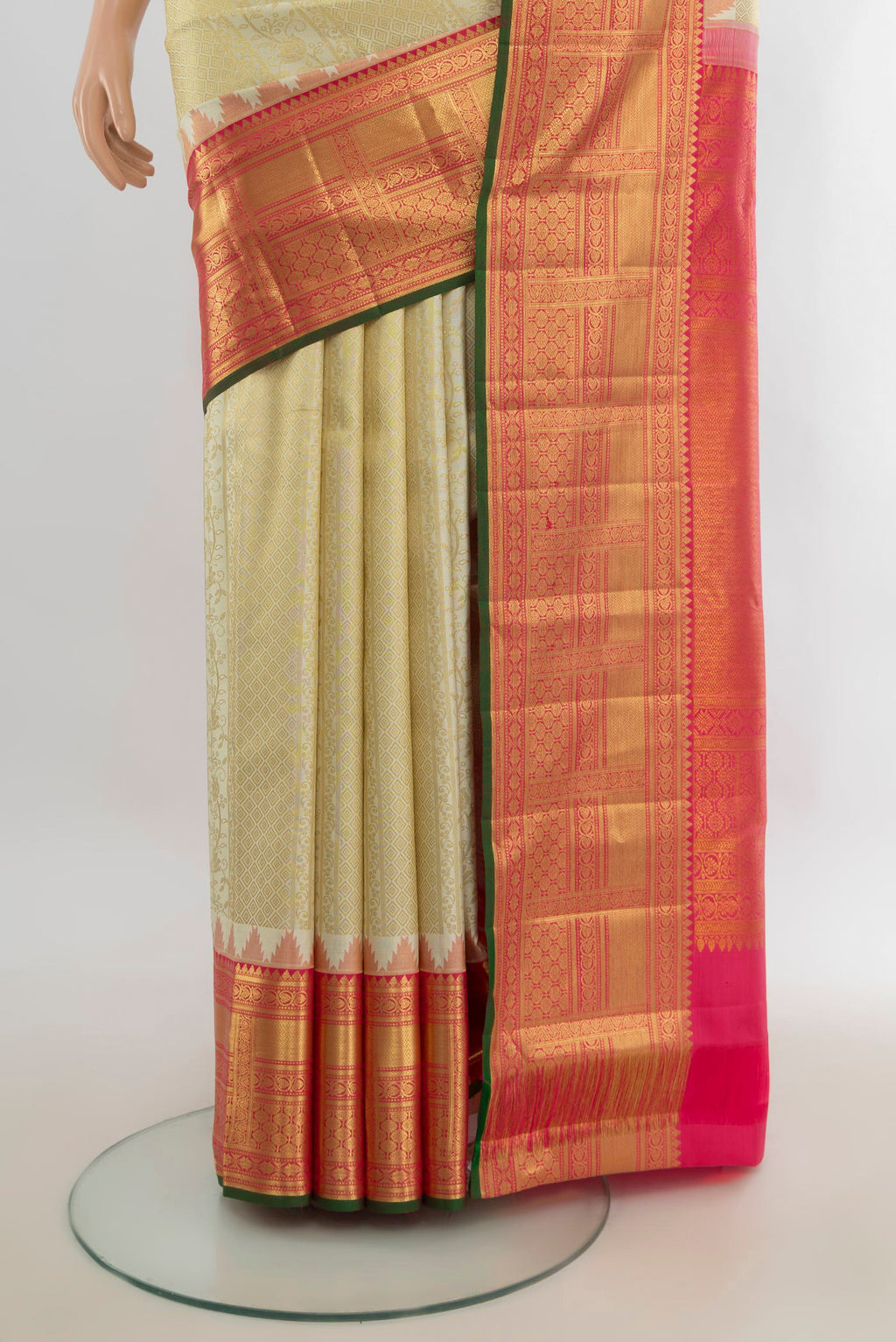 Pleats and pallu of Pure Silk Golden Kanjivaram Saree with Zari Butta on the body and Silk Border. 