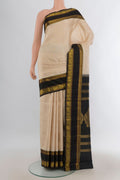 Pure Silk Sandal Kanjivaram Saree with Zari Butta on the body and Silk Border.  displayed on a mannequin