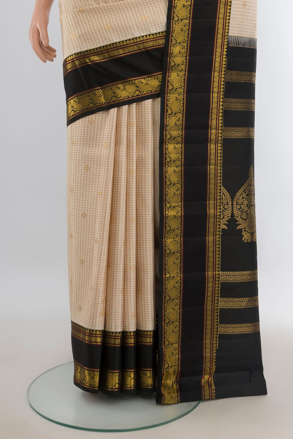 Pleats and pallu of Pure Silk Sandal Kanjivaram Saree with Zari Butta on the body and Silk Border. 