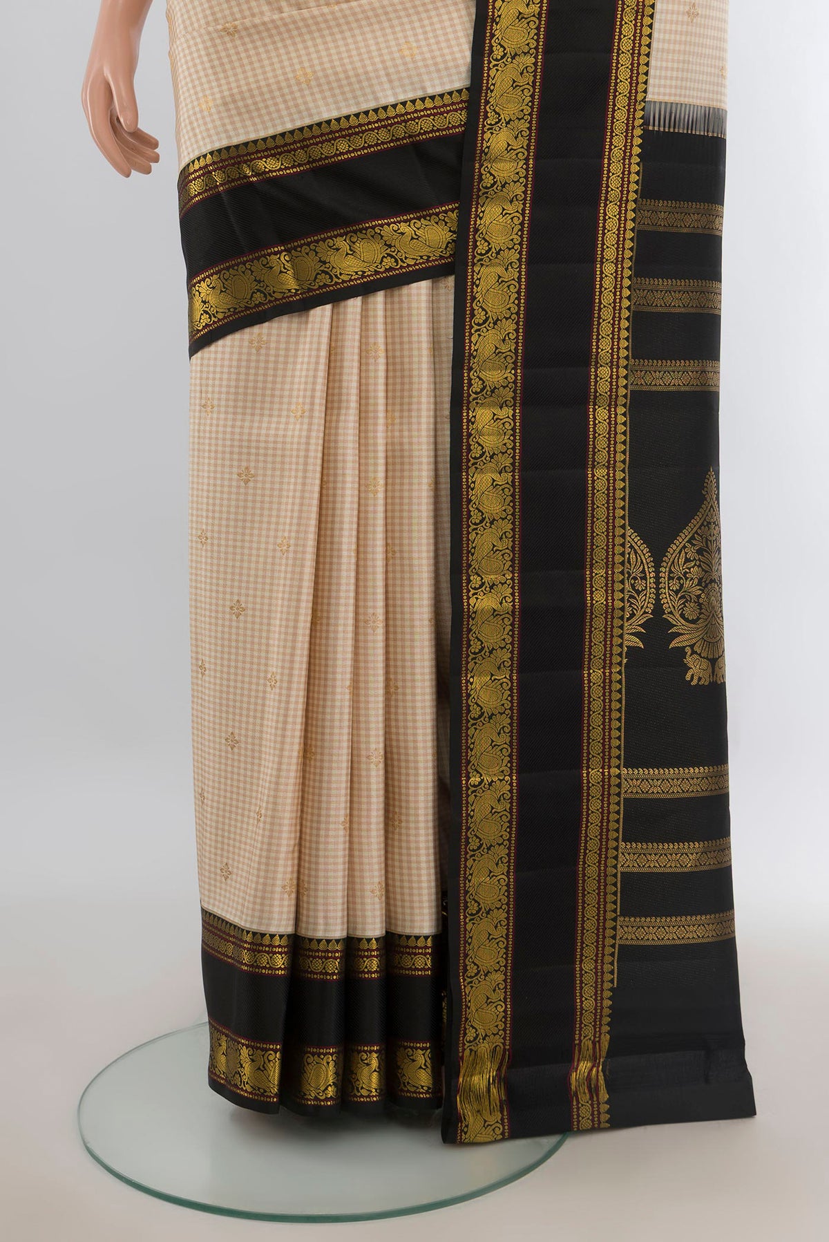 Pleats and pallu of Pure Silk Sandal Kanjivaram Saree with Zari Butta on the body and Silk Border. 