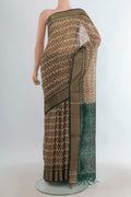 Grey Silk Cotton Saree with Ikat Print on the body and Zari Border.  displayed on a mannequin