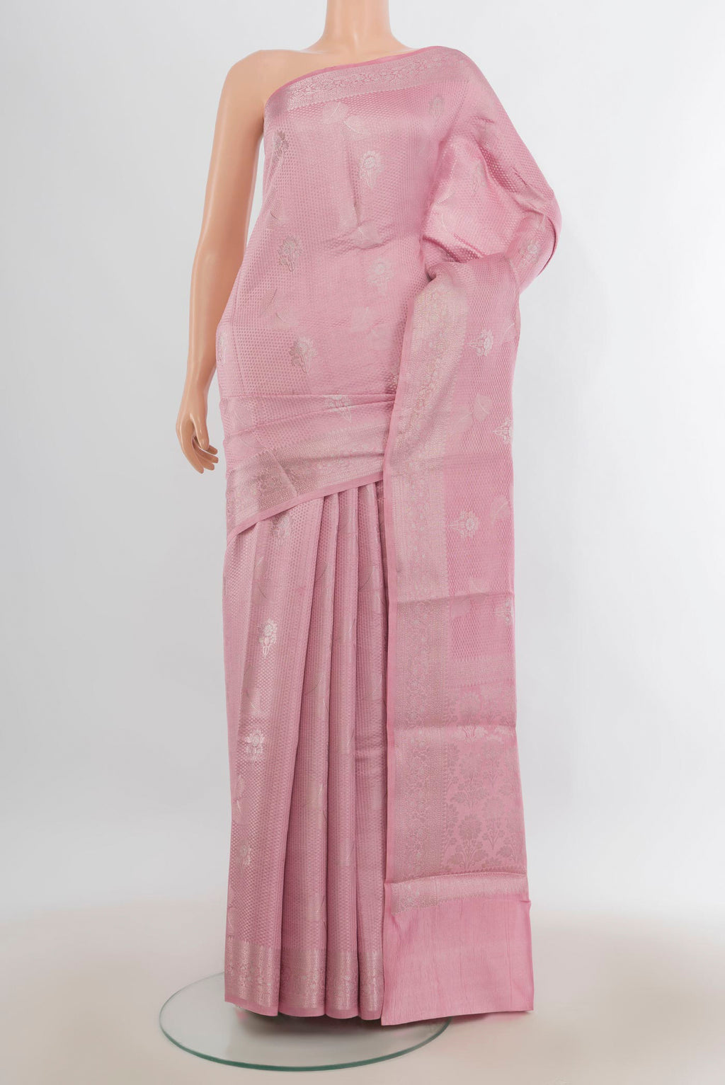 Pure Silk Rose pink Banarasi Raw Saree with Zari Butta on the body and Zari Border.  displayed on a mannequin