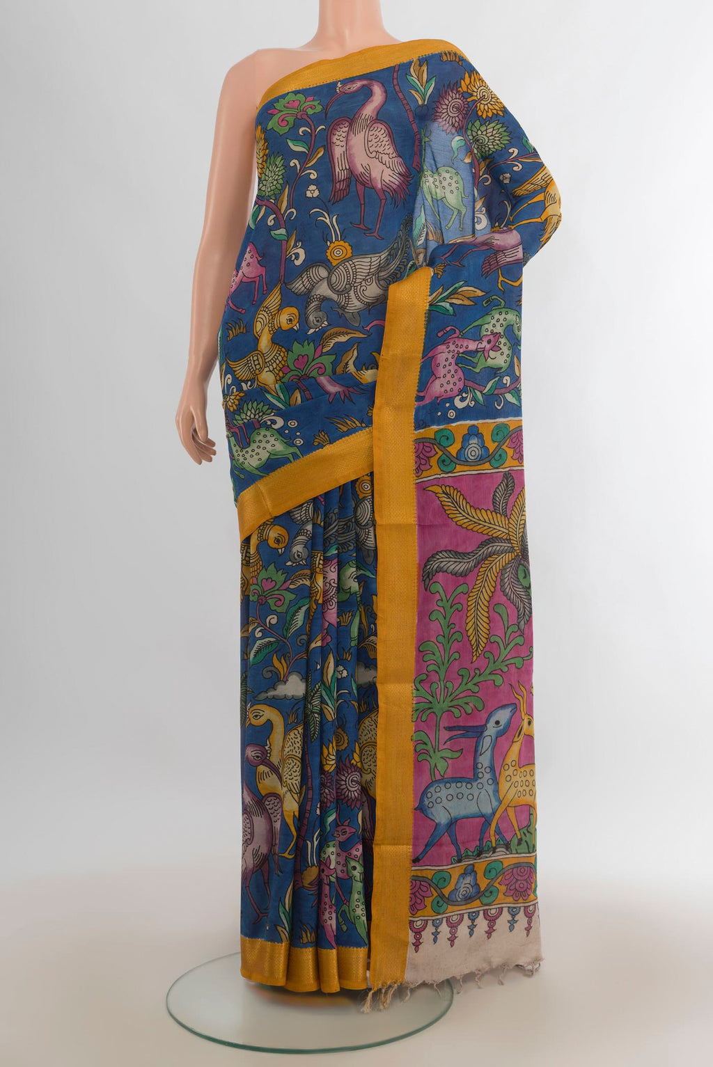 Pure Silk Blue kalamkari Saree with Floral Print on the body and Zari Border.  displayed on a mannequin