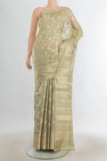 Pure Silk Olive Green Banarasi Raw Saree with Zari Butta on the body and Silk Border.  displayed on a mannequin