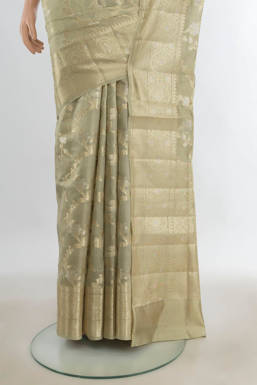 Pleats and pallu of Pure Silk Olive Green Banarasi Raw Saree with Zari Butta on the body and Silk Border. 