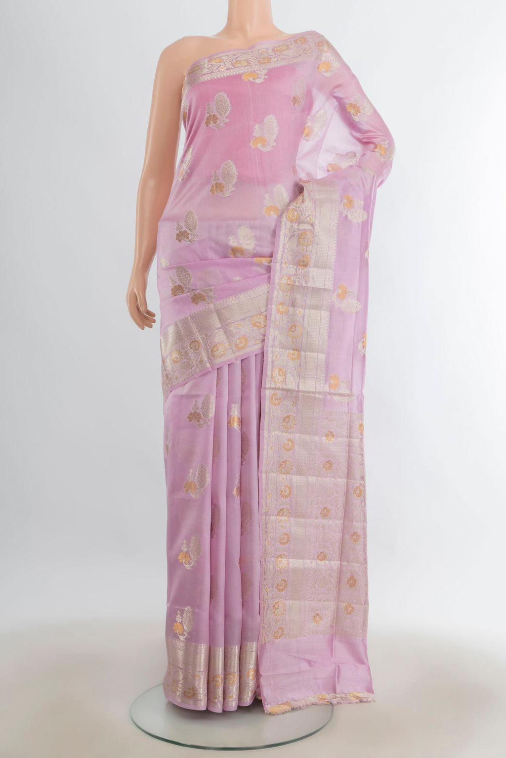 Pure Silk Rose Gold Banarasi Raw Saree with Zari Butta on the body and Silk Border.  displayed on a mannequin