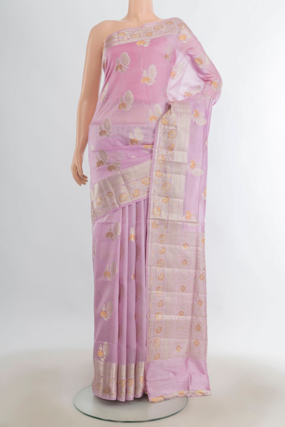 Pure Silk Rose Gold Banarasi Raw Saree with Zari Butta on the body and Silk Border.  displayed on a mannequin