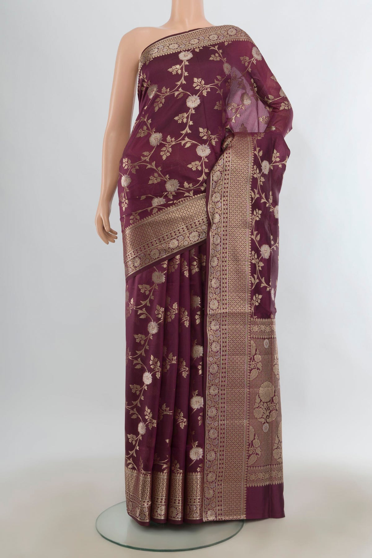 Pure Silk Coffee Brown Banarasi Raw Saree with Zari Brocade on the body and Zari Border.  displayed on a mannequin