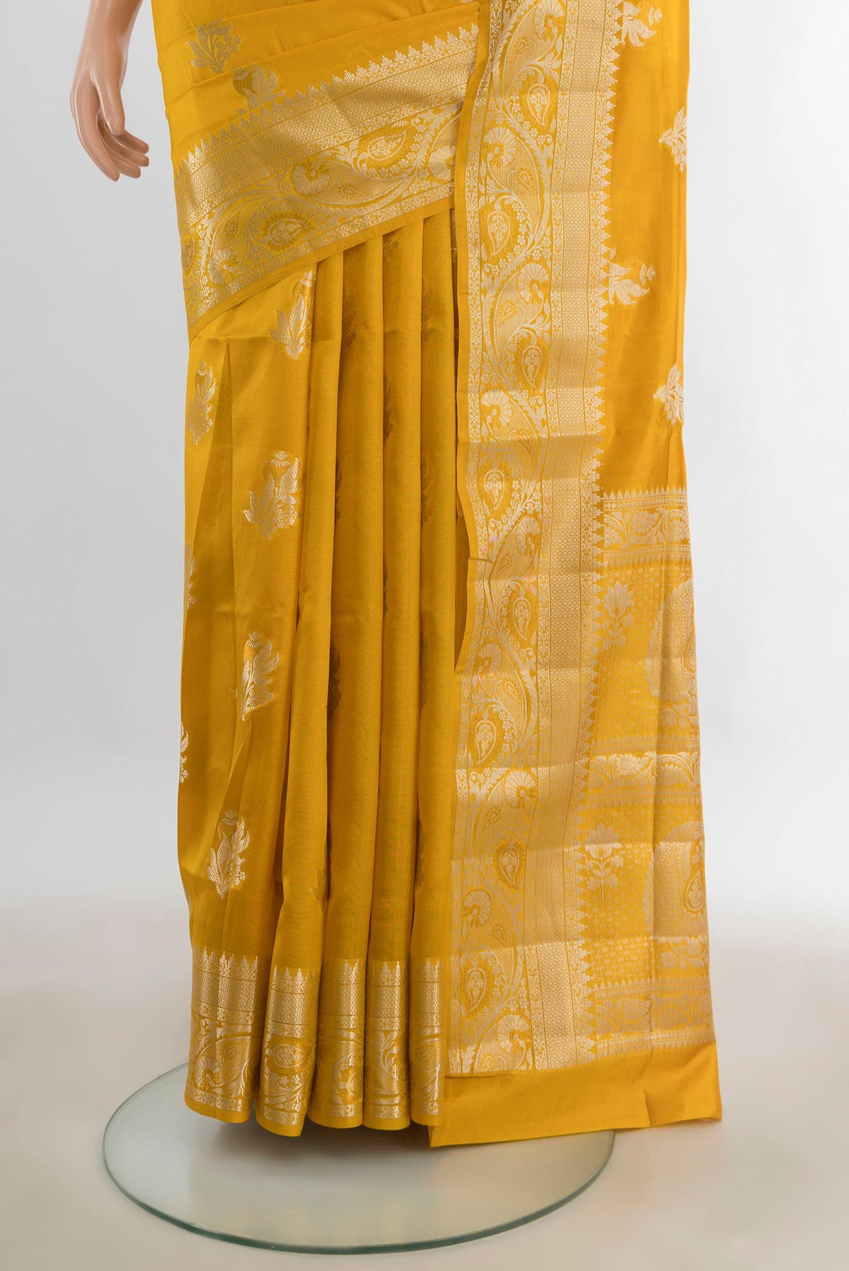 Pleats and pallu of Pure Silk Mustard Banarasi Raw Saree with Zari Butta on the body and Silk Border. 