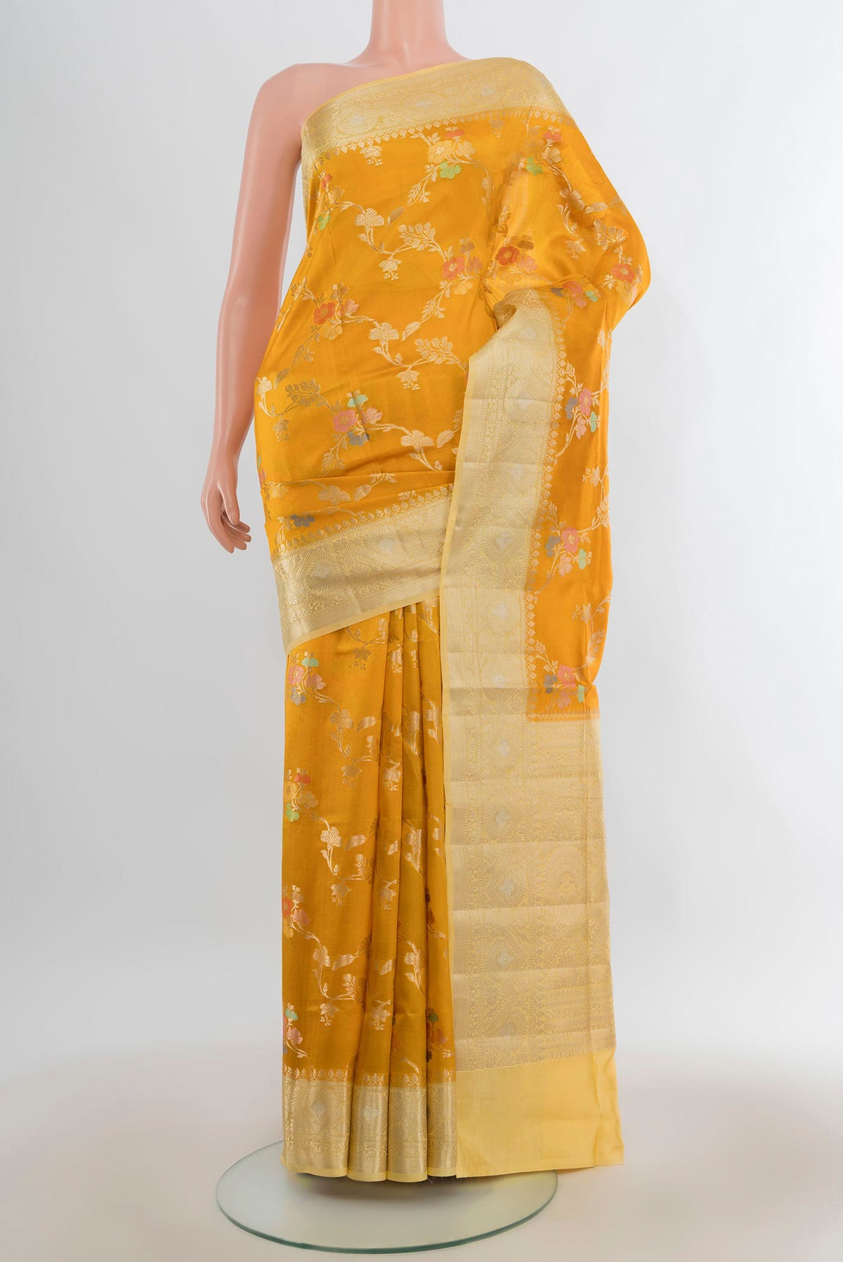 Pure Silk Yellow Banarasi Raw Saree with Zari Butta on the body and Zari Border.  displayed on a mannequin