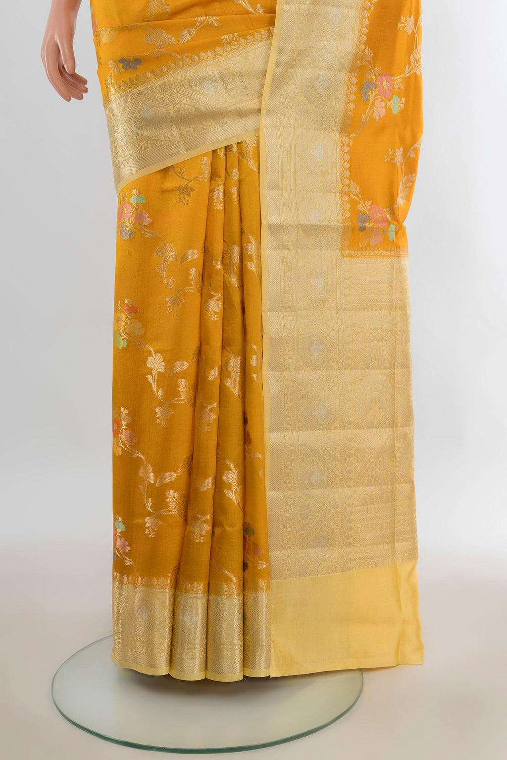 Pleats and pallu of Pure Silk Yellow Banarasi Raw Saree with Zari Butta on the body and Zari Border. 