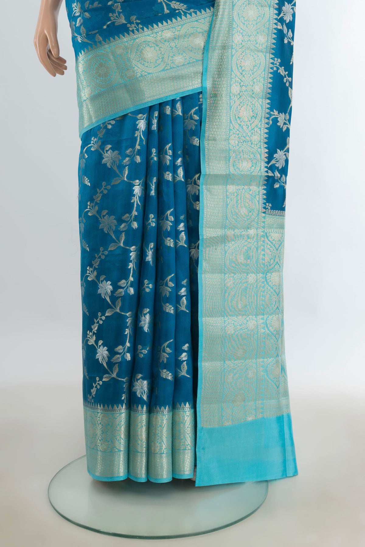 Pleats and pallu of Pure Silk Peacock Blue Banarasi Raw Saree with Zari Butta on the body and Silk Border. 