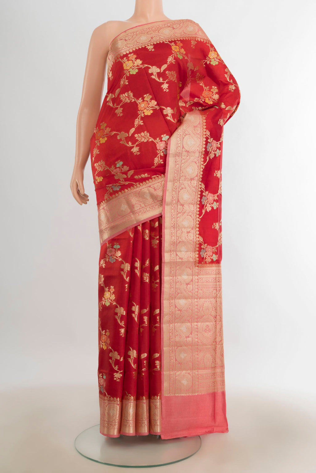 Pure Silk Red Banarasi Raw Saree with Zari Butta on the body and Silk Border.  displayed on a mannequin