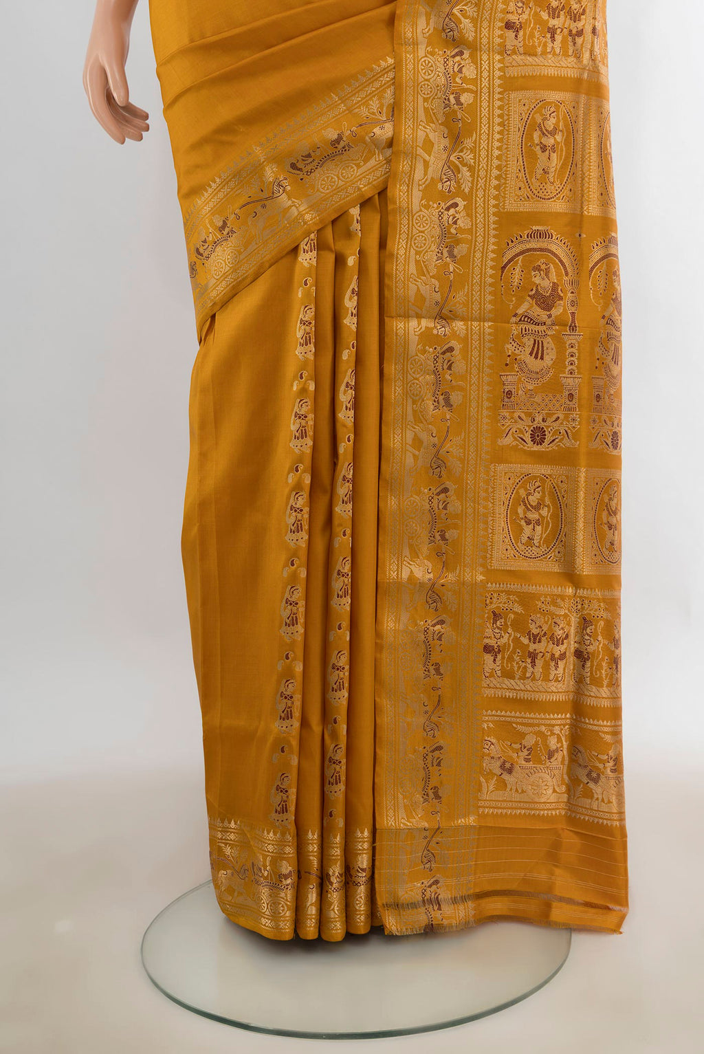 Pleats and pallu of Pure Silk Mustard Baluchari Saree with Thread Butta on the body and Zari Border. 