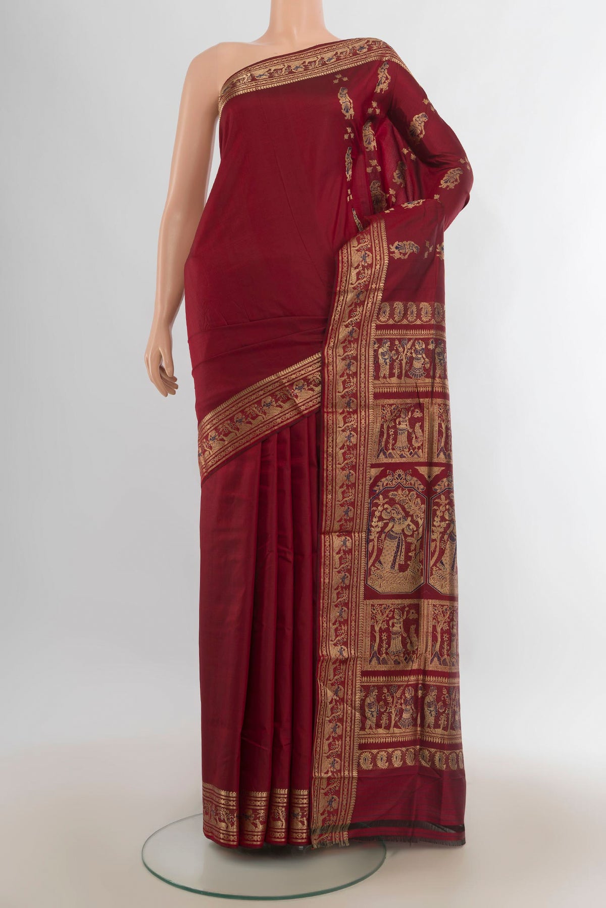 Pure Silk Maroon Baluchari Saree with Zari Butta on the body and Zari Border.  displayed on a mannequin