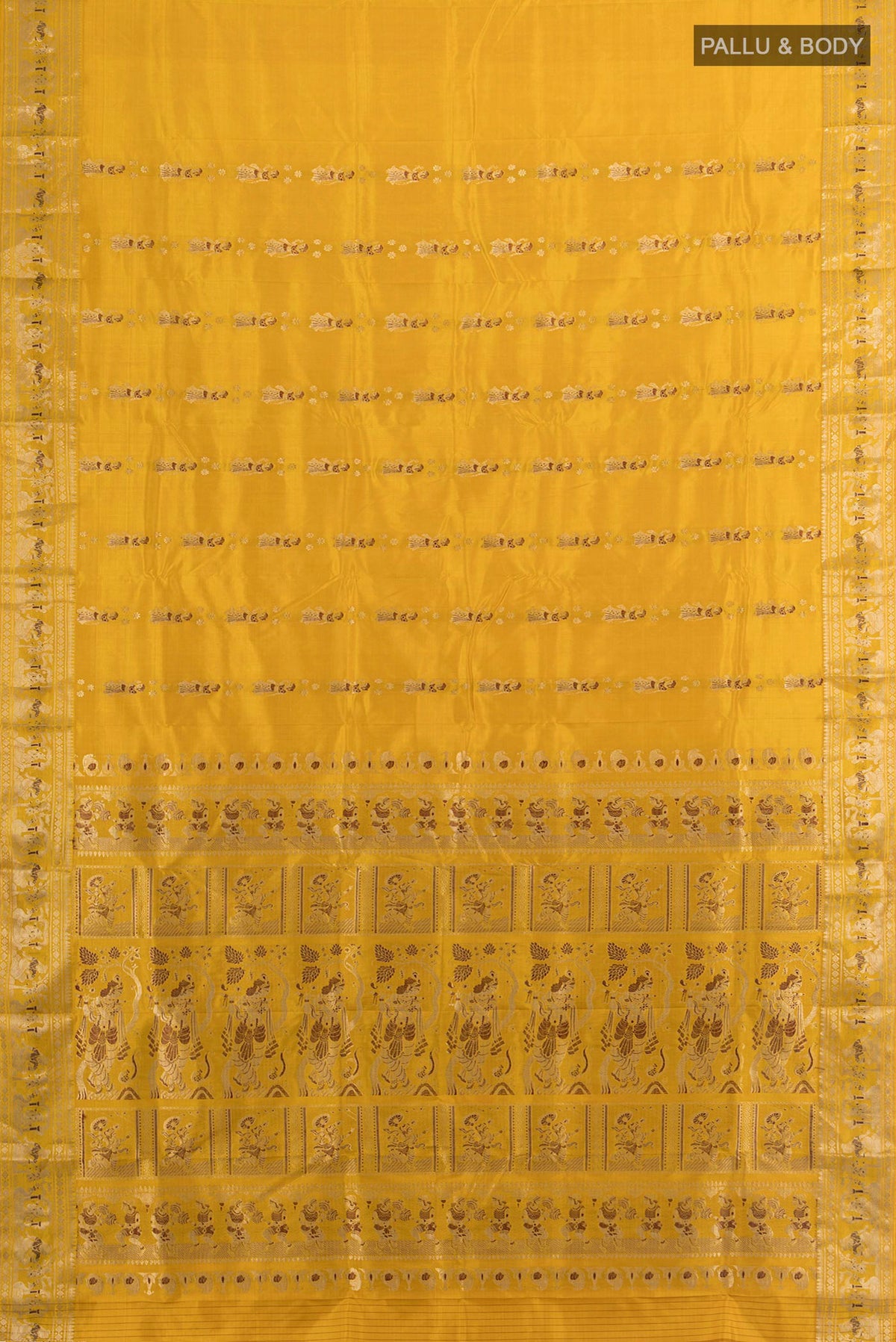 Flat view of Pure Silk Mustard Baluchari Saree with Zari Butta on the body and Zari Border. 