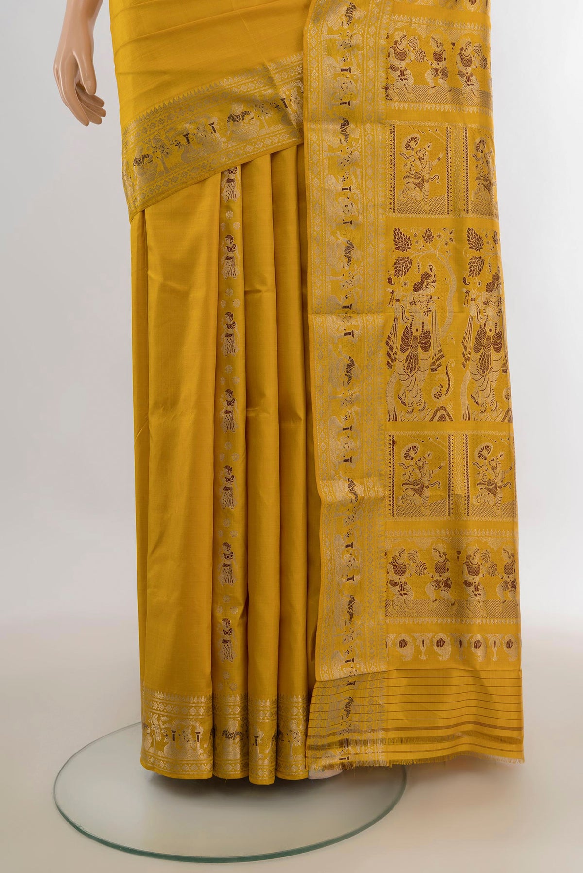 Pleats and pallu of Pure Silk Mustard Baluchari Saree with Zari Butta on the body and Zari Border. 