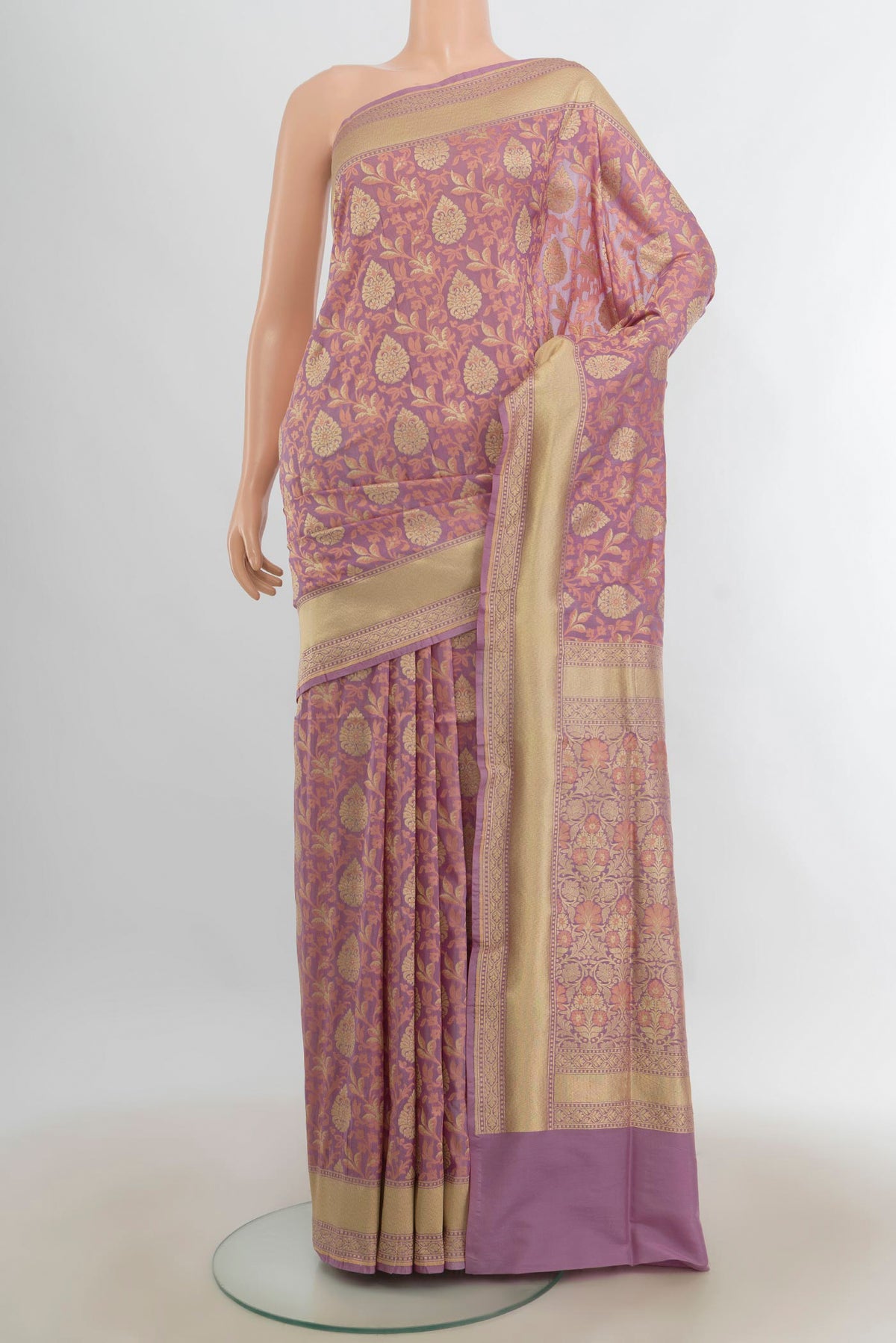 Pure Silk Bronze Banarasi Saree with Zari Butta on the body and Silk Border.  displayed on a mannequin
