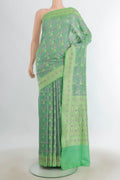 Pure Silk Multi Color Banarasi Saree with Thread Butta on the body and Silk Border.  displayed on a mannequin