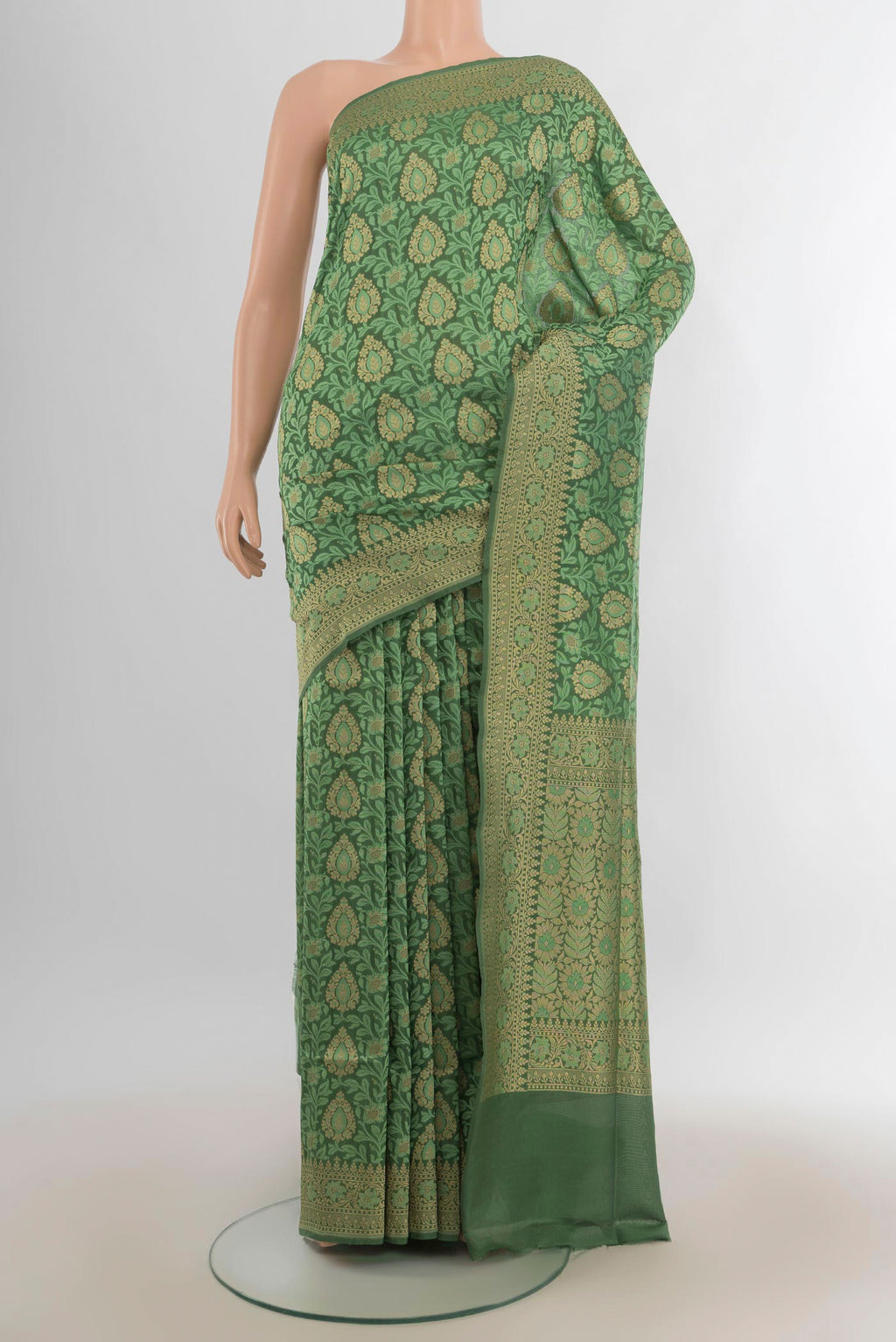 Pure Silk Green Banarasi Saree with Zari Brocade on the body and Zari Border.  displayed on a mannequin