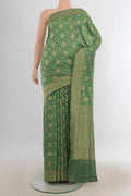 Pure Silk Green Banarasi Saree with Zari Brocade on the body and Zari Border.  displayed on a mannequin