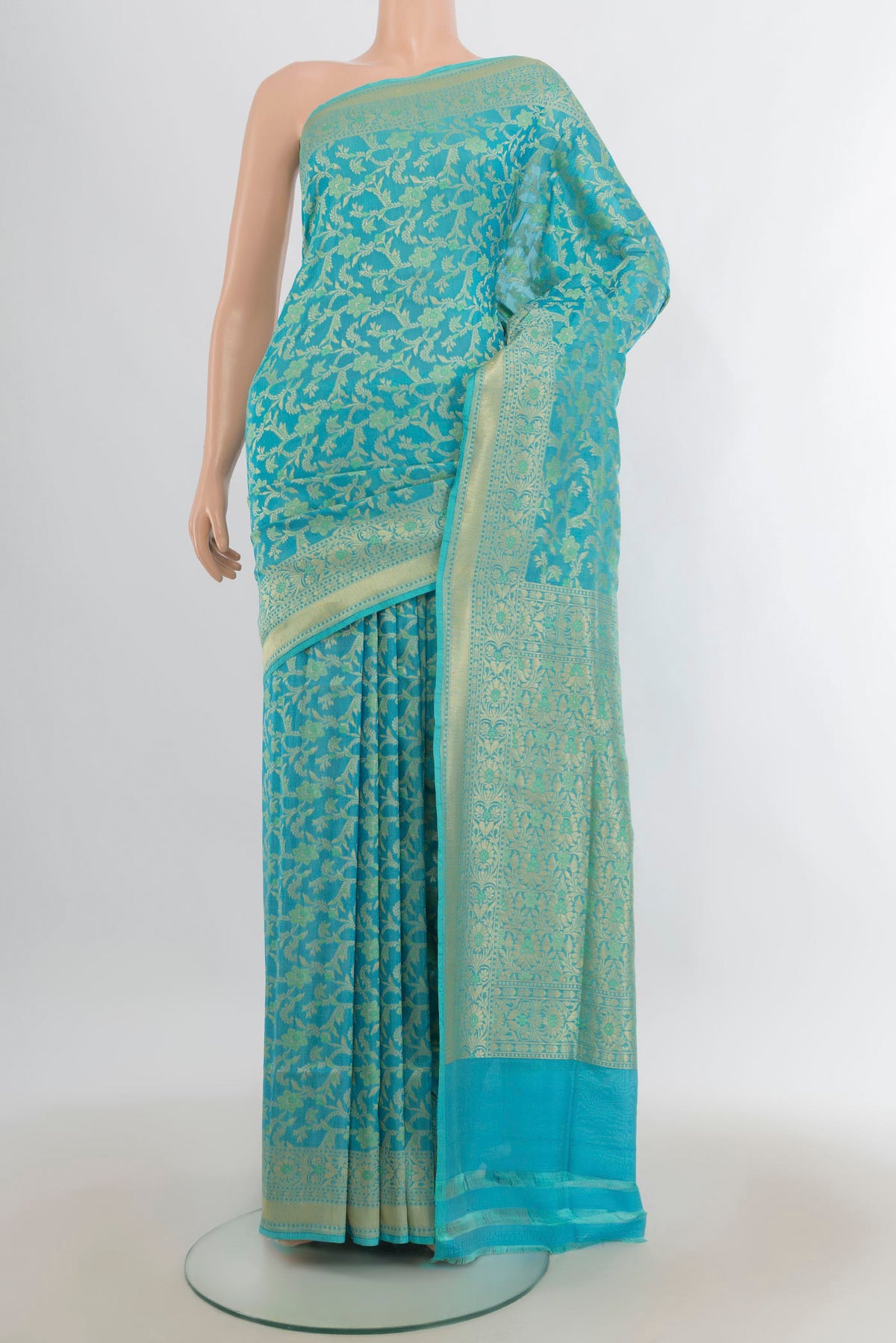 Pure Silk Sky Blue Banarasi Saree with Zari Brocade on the body and Zari Border.  displayed on a mannequin
