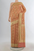 Pure Silk Peach Banarasi Saree with Jacquard With Zari Butta on the body and Zari Border.  displayed on a mannequin