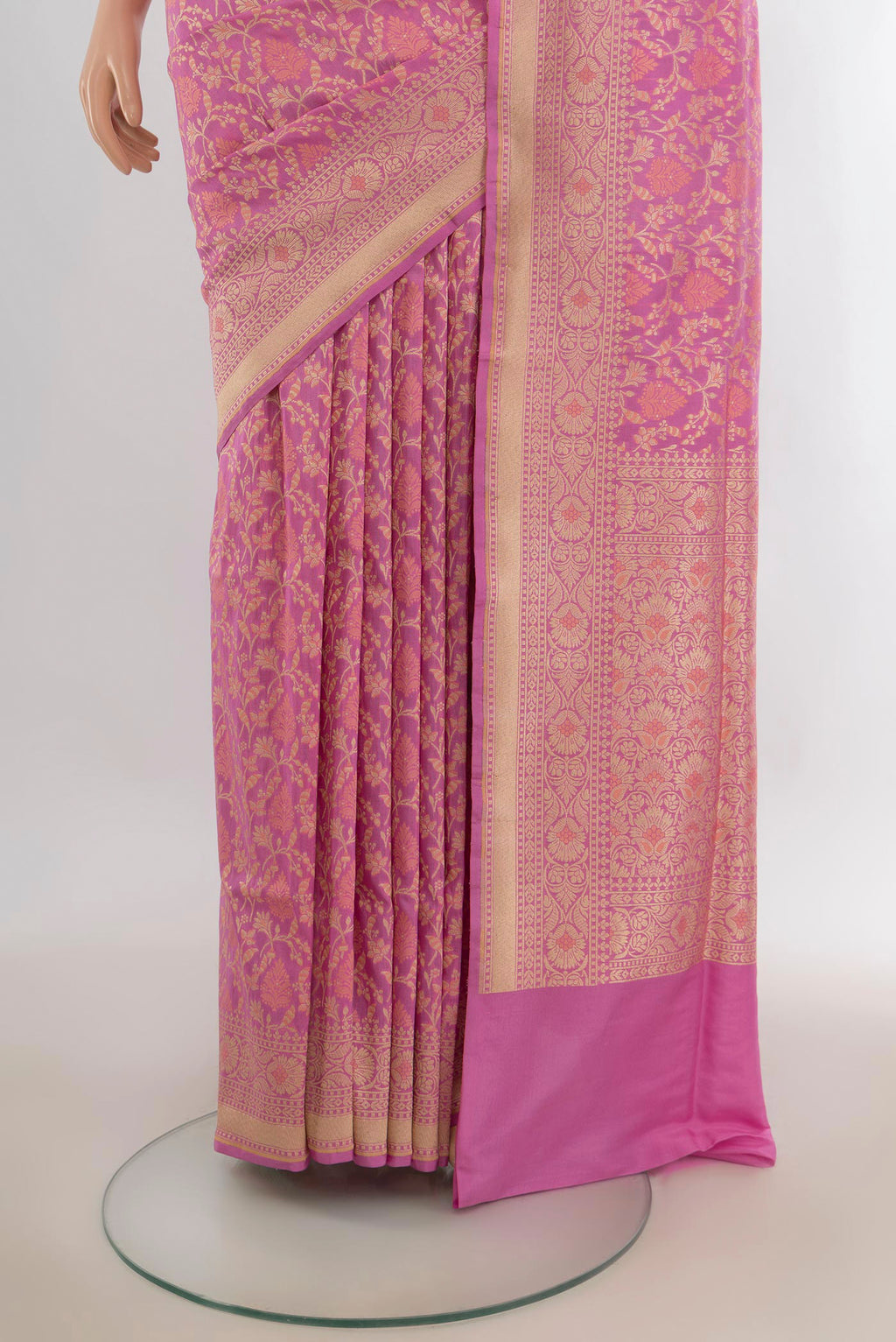 Pleats and pallu of Pure Silk Rose pink Banarasi Saree with Jacquard With Zari Butta on the body and Zari Border. 