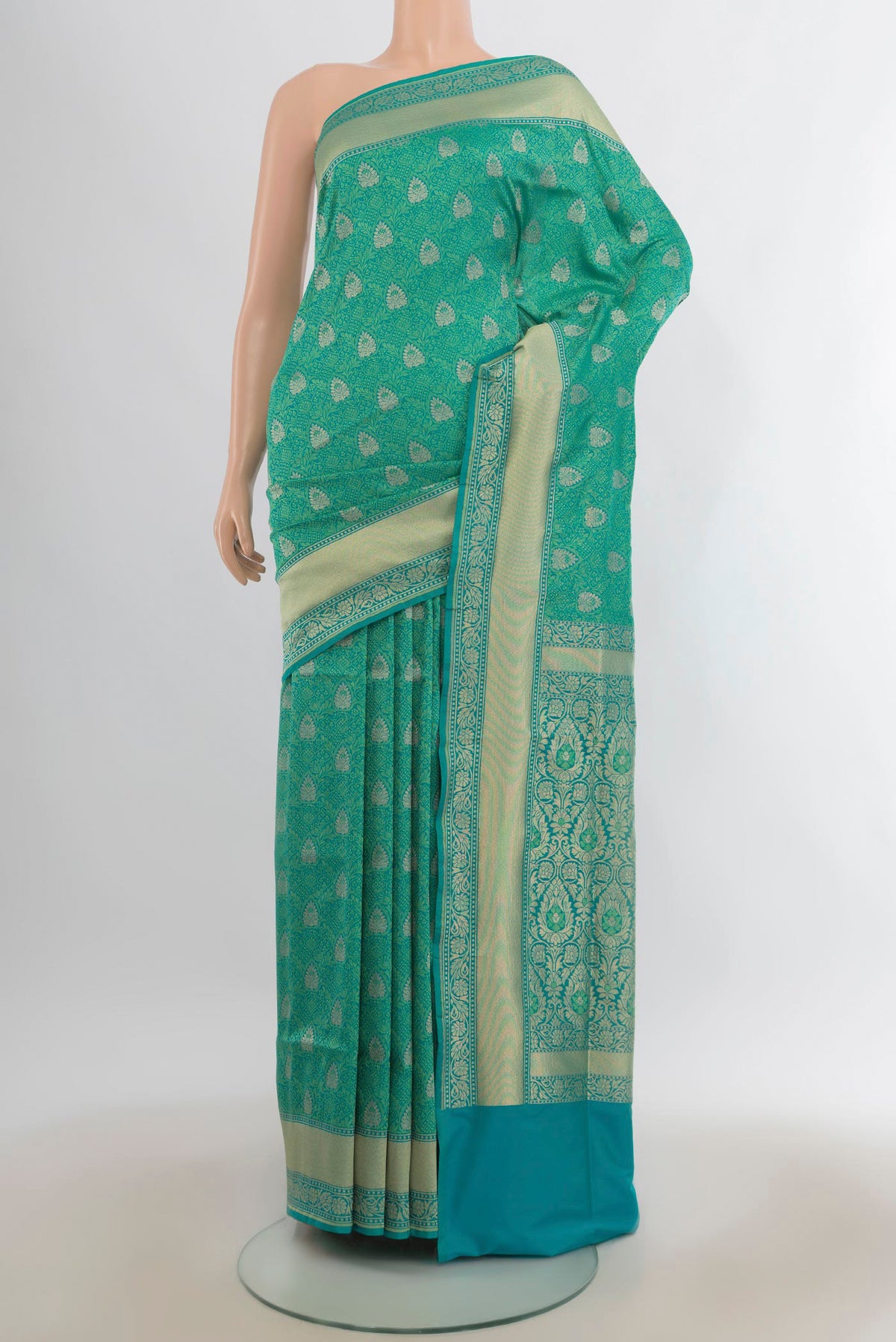 Pure Silk Sea Green Banarasi Saree with Jacquard With Zari Butta on the body and Zari Border.  displayed on a mannequin