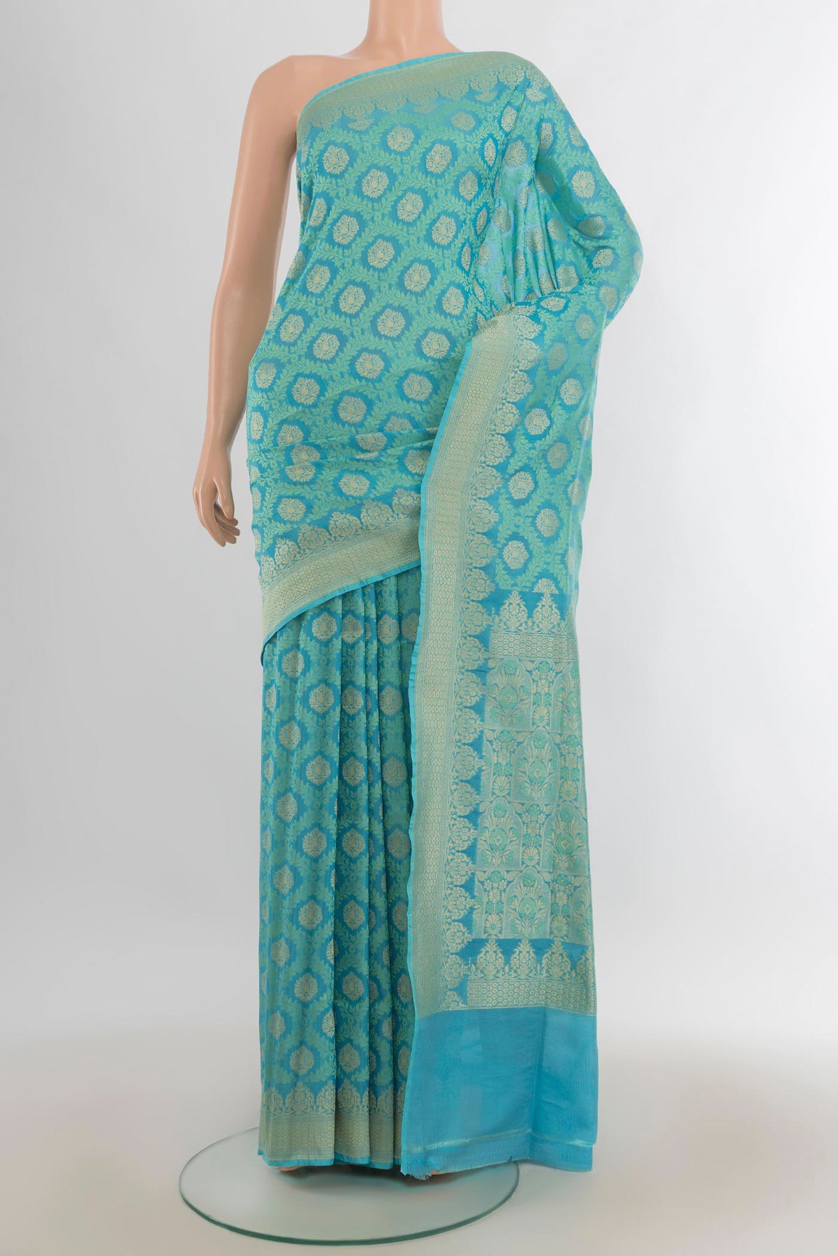 Pure Silk Turquoise Banarasi Saree with Jacquard With Zari Butta on the body and Zari Border.  displayed on a mannequin