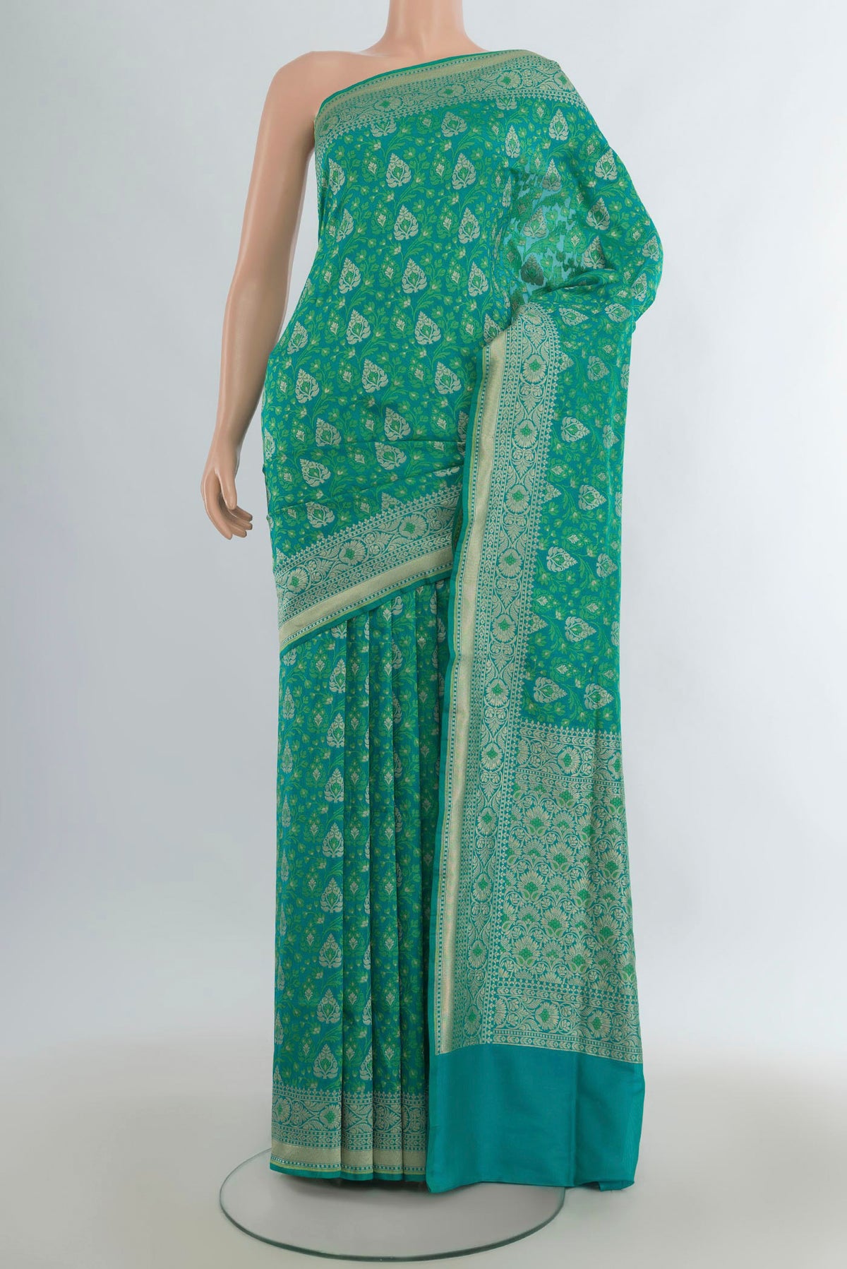 Pure Silk Sea Green Banarasi Saree with Jacquard design on the body and Zari Border.  displayed on a mannequin