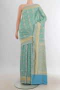 Pure Silk Light Blue Banarasi Saree with Jacquard With Zari Butta on the body and Zari Border.  displayed on a mannequin