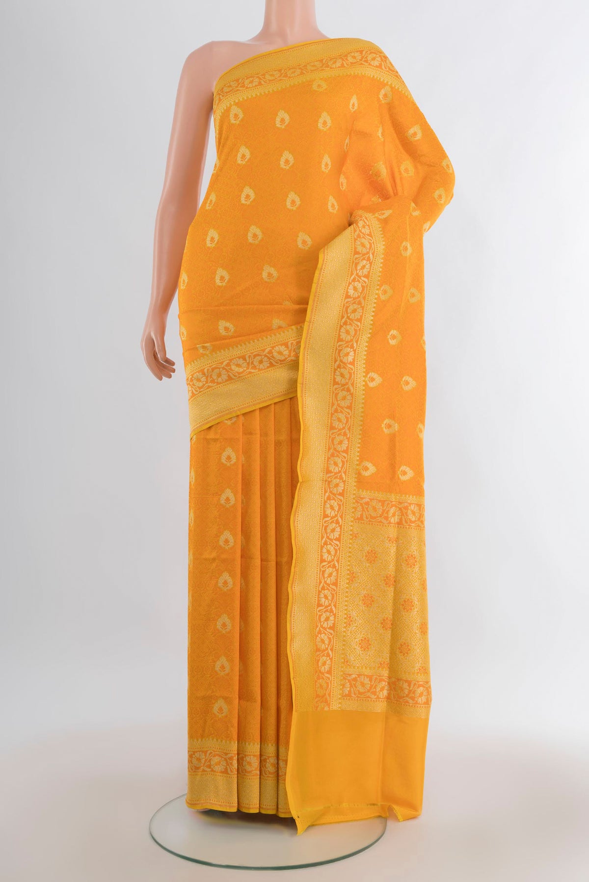 Pure Silk Yellow Banarasi Saree with Zari Butta on the body and Zari Border.  displayed on a mannequin