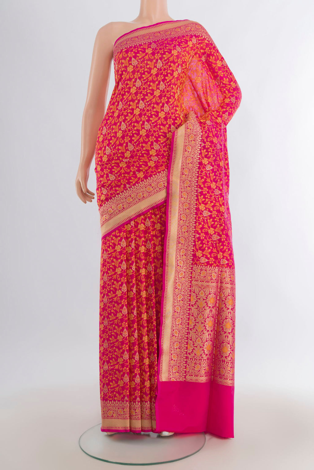Pure Silk Rani Pink Banarasi Saree with Jacquard design on the body and Zari Border.  displayed on a mannequin