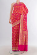 Pure Silk Rani Pink Banarasi Saree with Jacquard design on the body and Zari Border.  displayed on a mannequin