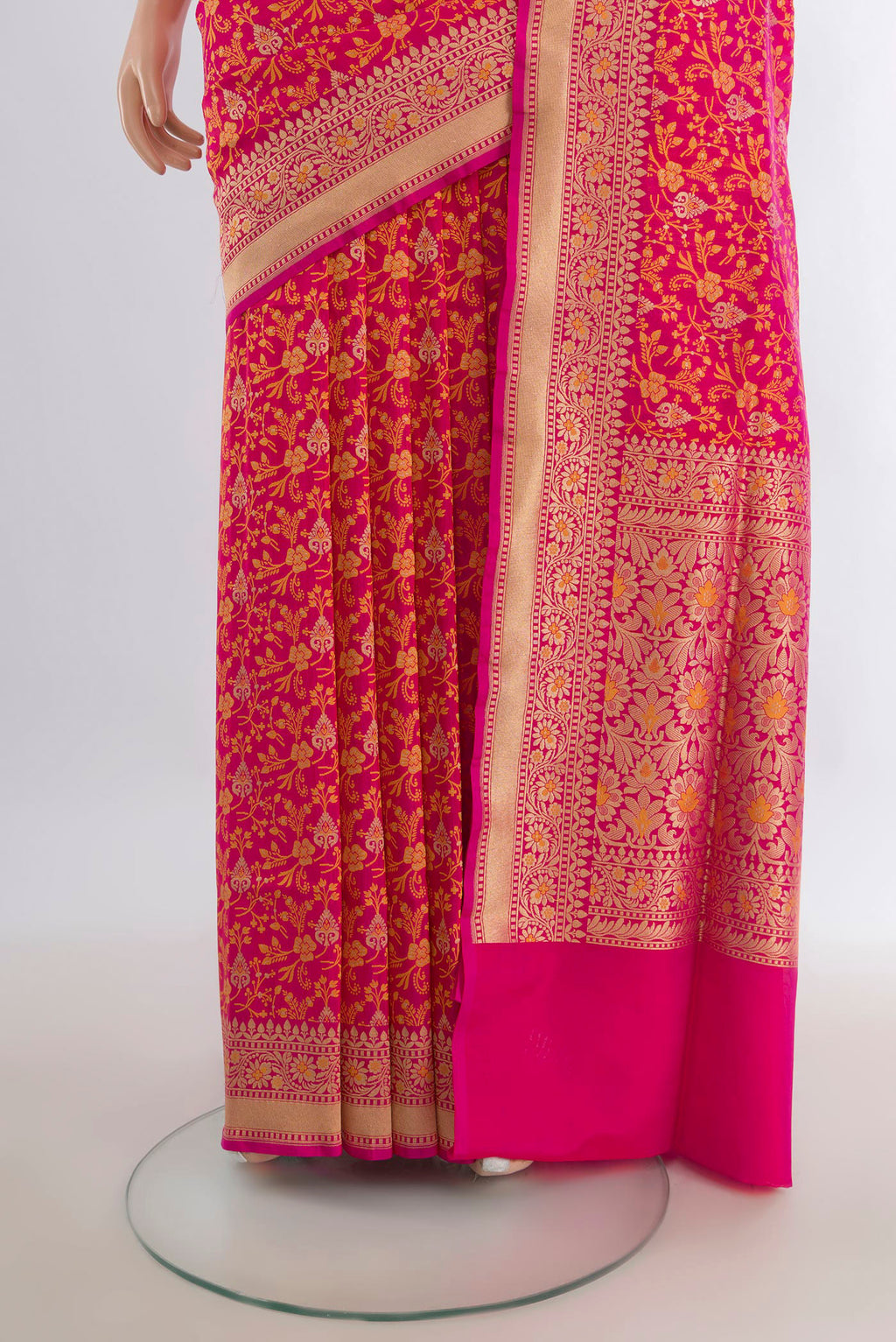 Pleats and pallu of Pure Silk Rani Pink Banarasi Saree with Jacquard design on the body and Zari Border. 