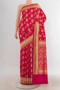 Pure Silk Dark Pink Banarasi Saree with Jacquard With Zari Butta on the body and Zari Border.  displayed on a mannequin