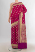 Pure Silk Magenta Banarasi Saree with Jacquard With Zari Butta on the body and Zari Border.  displayed on a mannequin
