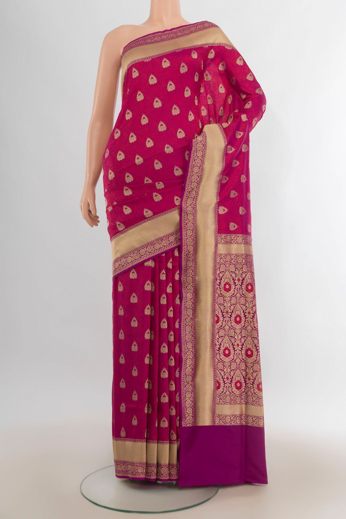 Pure Silk Magenta Banarasi Saree with Jacquard With Zari Butta on the body and Zari Border.  displayed on a mannequin