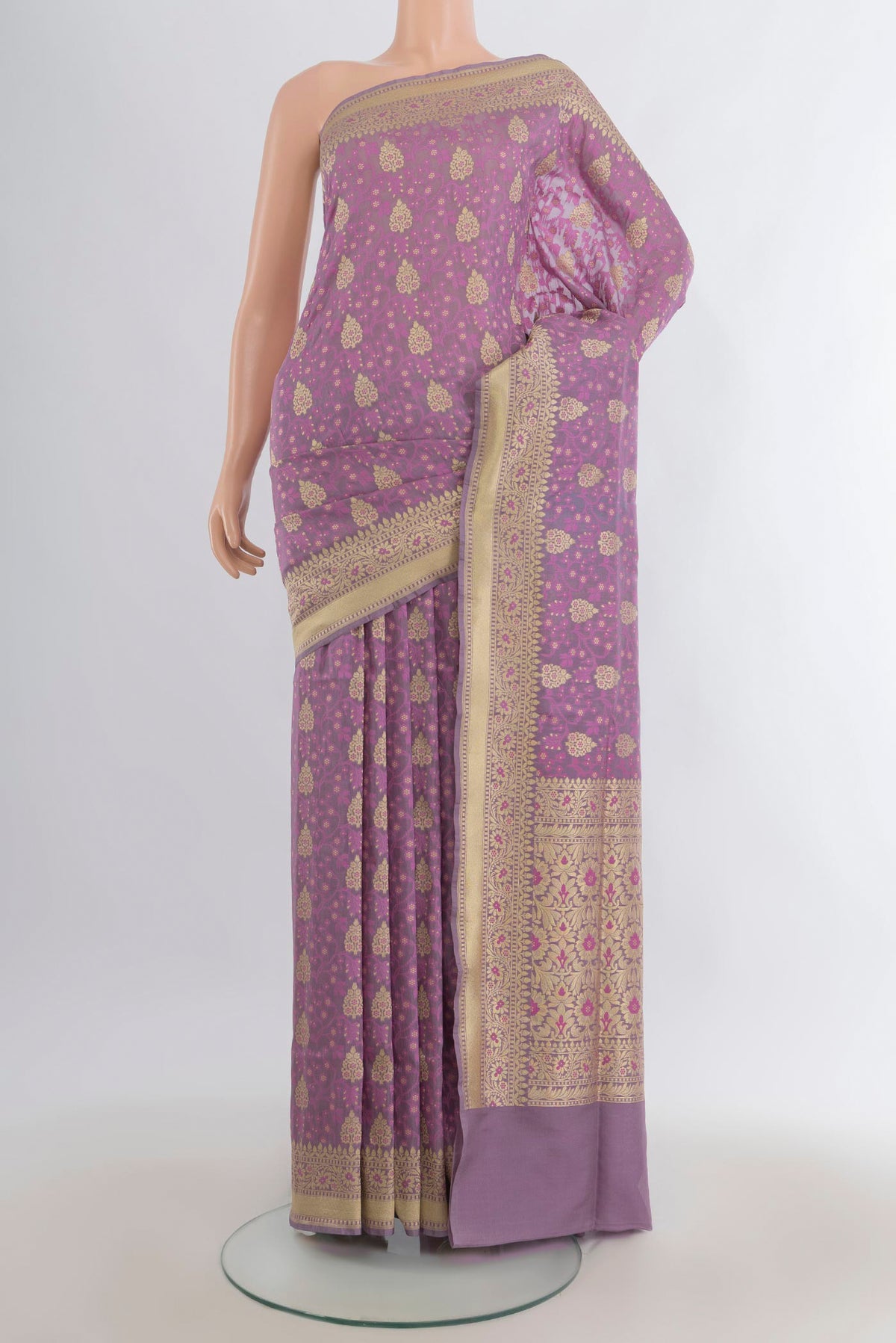 Pure Silk Lavender Banarasi Saree with Zari And Thread Butta on the body and Zari Border.  displayed on a mannequin