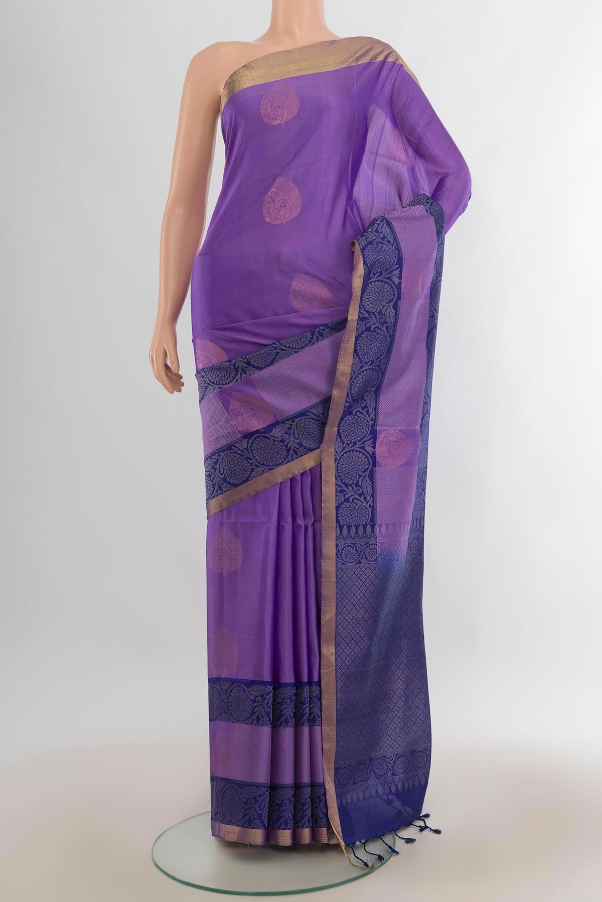Pure Silk Lavender Soft Saree with Zari Butta on the body and Zari Border.  displayed on a mannequin