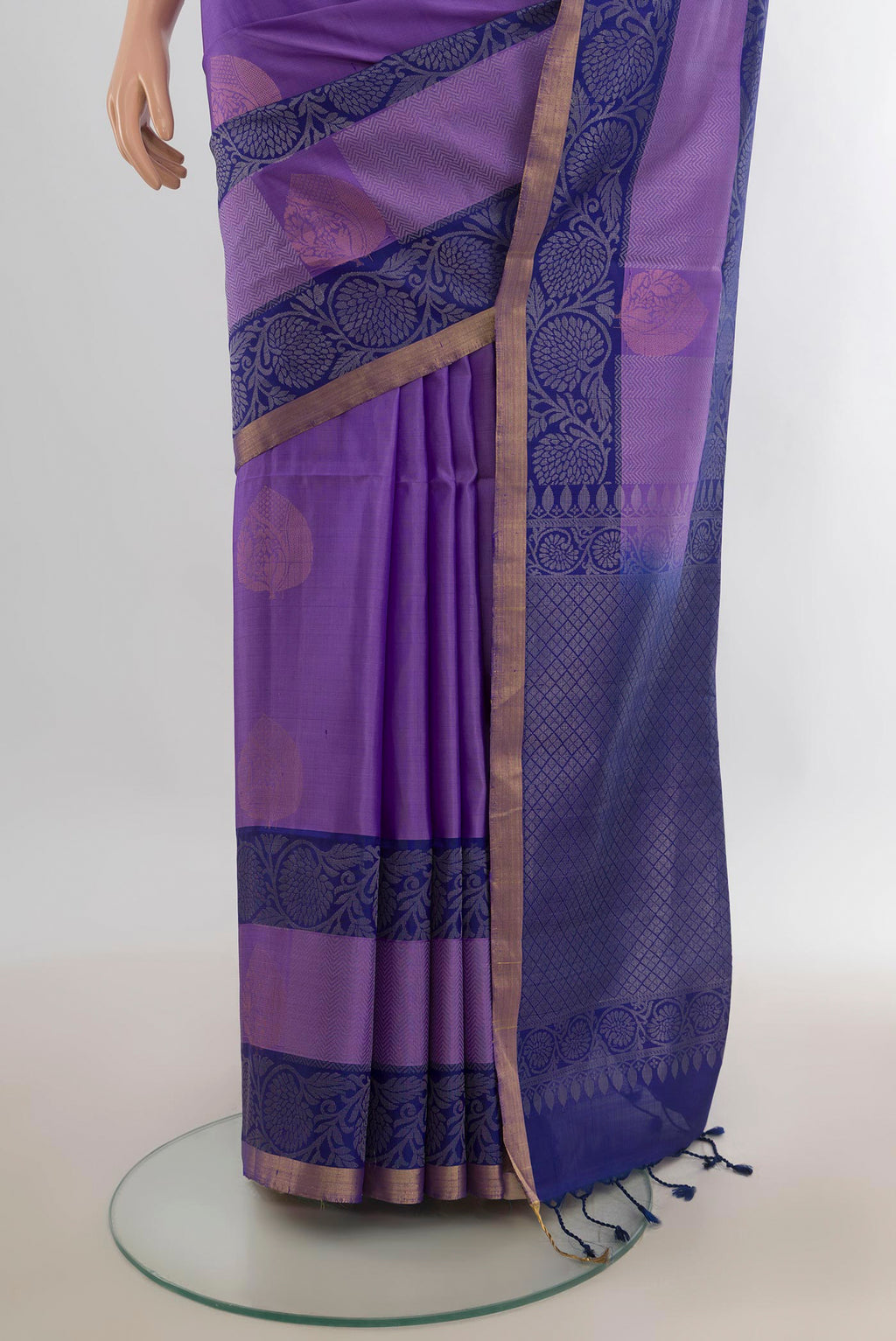 Pleats and pallu of Pure Silk Lavender Soft Saree with Zari Butta on the body and Zari Border. 