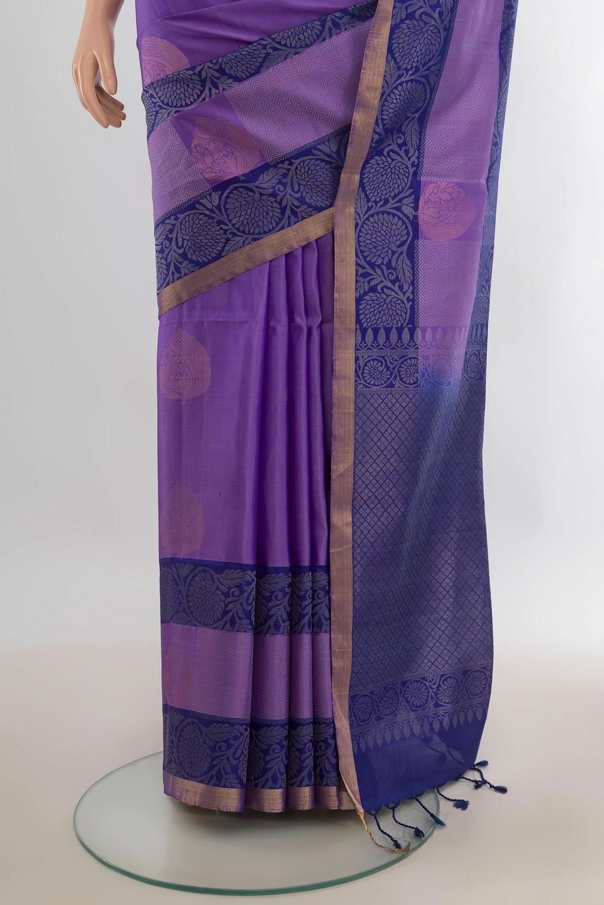 Pleats and pallu of Pure Silk Lavender Soft Saree with Zari Butta on the body and Zari Border. 